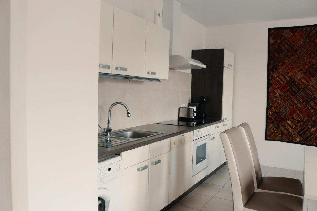 Kuchyň nebo kuchyňský kout v ubytování Vienna Airport Residences
