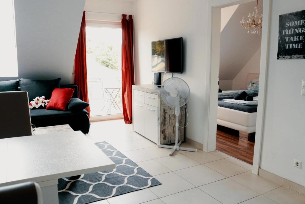 TV a/nebo společenská místnost v ubytování Vienna Airport Residences