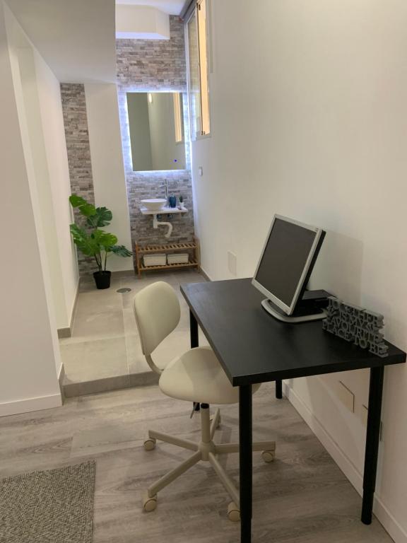 TV a/nebo společenská místnost v ubytování CoLiving El Toro