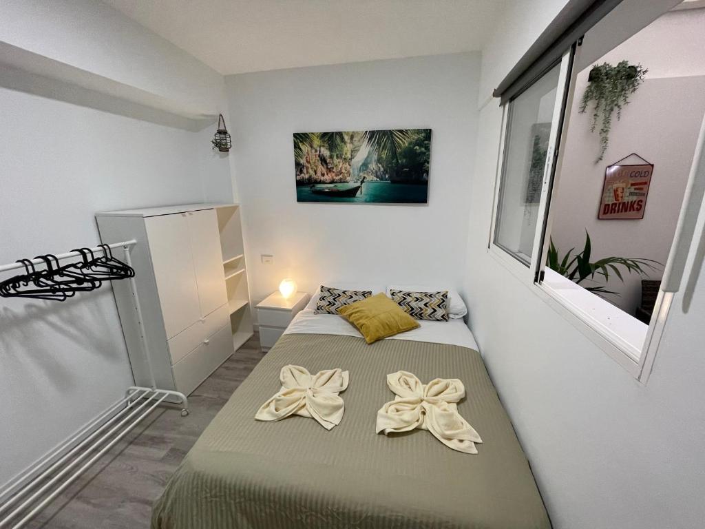Postel nebo postele na pokoji v ubytování CoLiving El Toro
