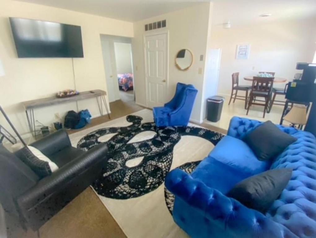 a living room with a couch and blue chairs at 17 S First - Unit 6 17 s first street unit 6 in Trenton