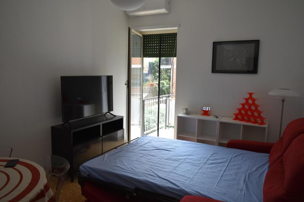 A television and/or entertainment centre at Zio Romano Apartment Rome - Vatican area