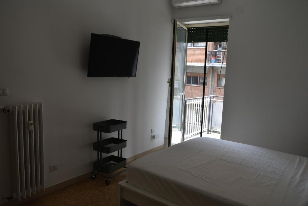 A television and/or entertainment centre at Zio Romano Apartment Rome - Vatican area