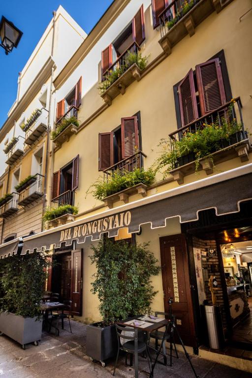 a building with a sign that reads the monkey islandallo at Locanda del Buongustaio in Cagliari