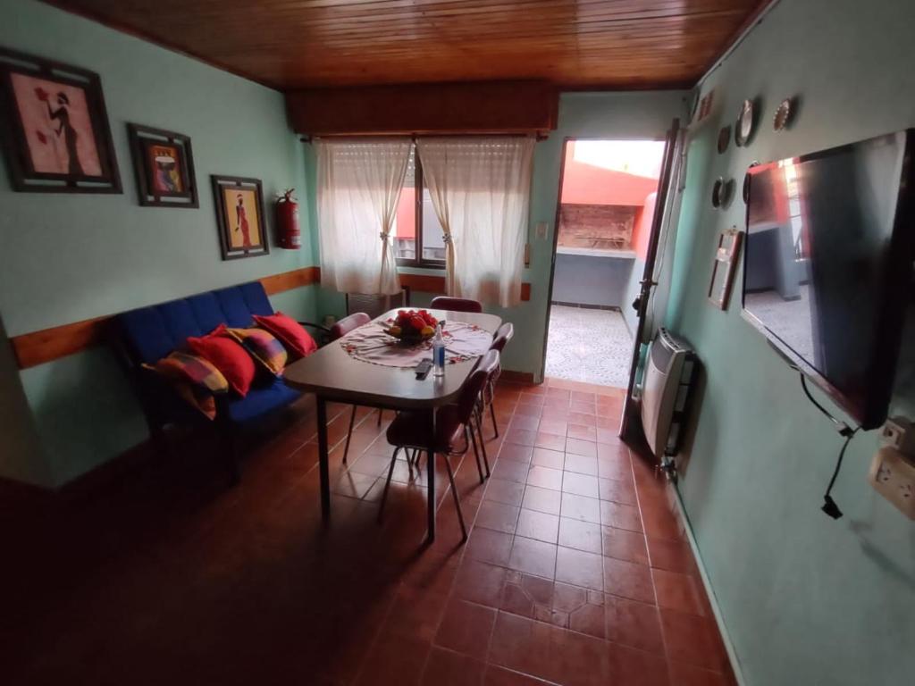 a living room with a table and a couch at La Galleguita in Colón