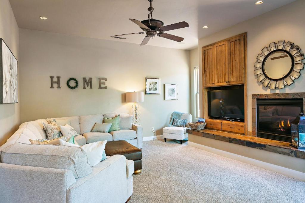 a living room with a couch and a fireplace at Lava Falls #9 townhouse in Santa Clara