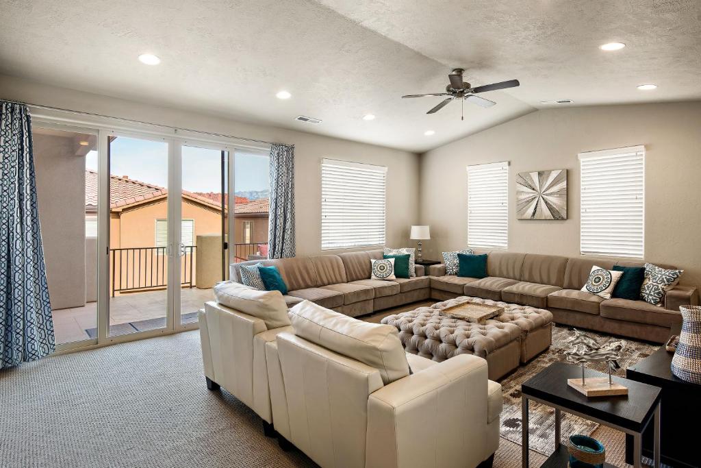 a living room with a couch and a table at Four-Bedroom House in Santa Clara