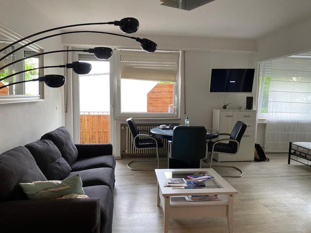 a living room with a couch and a table at Green House Strassen in Strassen