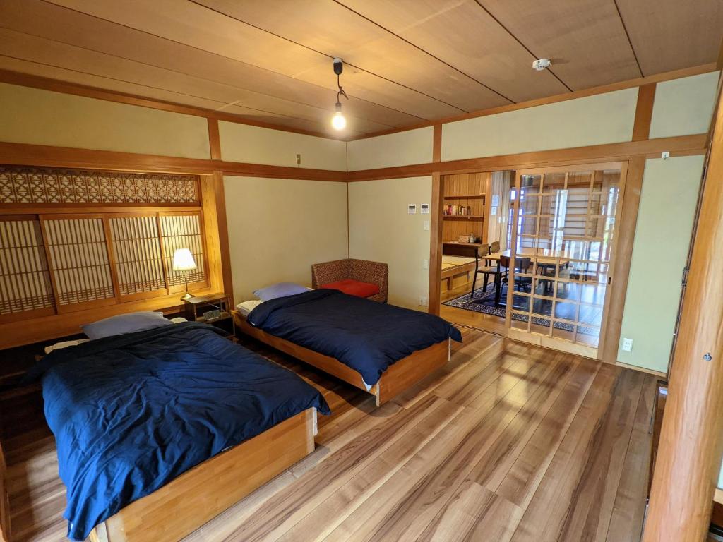 Postel nebo postele na pokoji v ubytování Yuzan apartment Sanjo