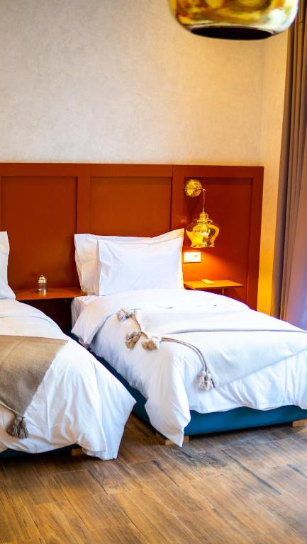 Postel nebo postele na pokoji v ubytování Riad villa saphir & SPA