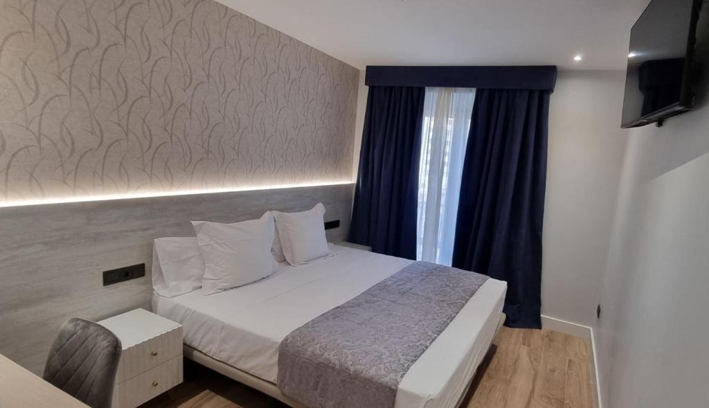 Posteľ alebo postele v izbe v ubytovaní CH La Petite Maison - Boutique - Madrid