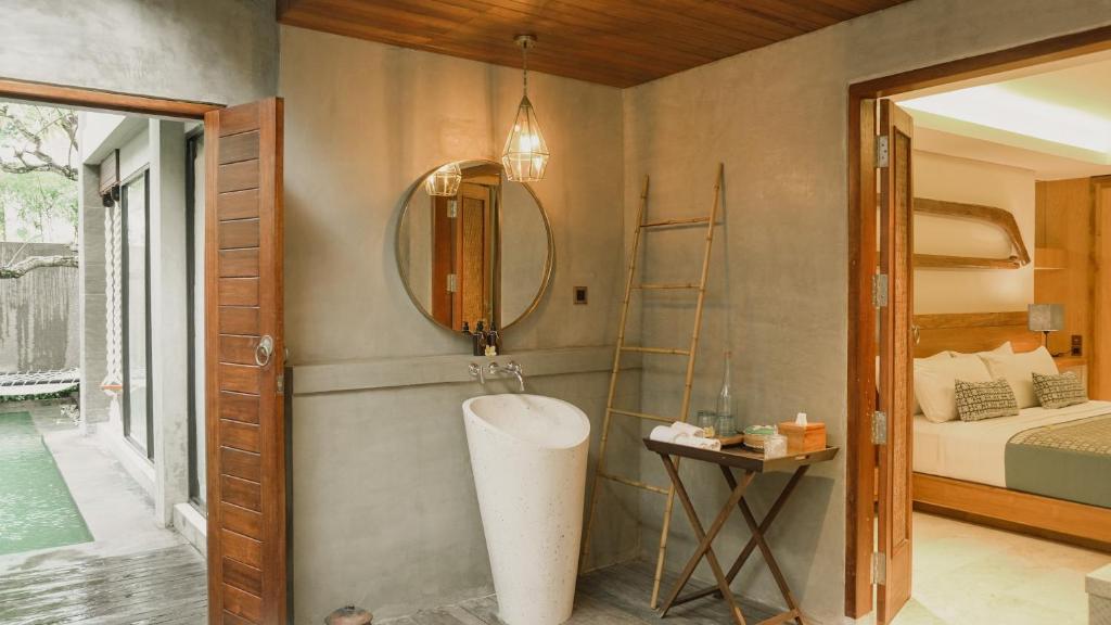 Postel nebo postele na pokoji v ubytování Annora Villas Seminyak