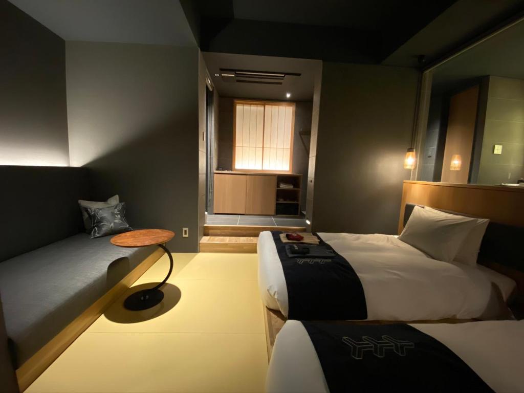 Postel nebo postele na pokoji v ubytování Hotel Zagakukan