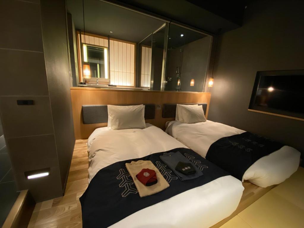 Postel nebo postele na pokoji v ubytování Hotel Zagakukan