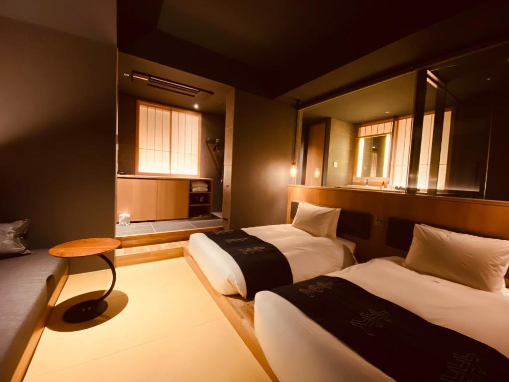 Postel nebo postele na pokoji v ubytování Hotel Zagakukan
