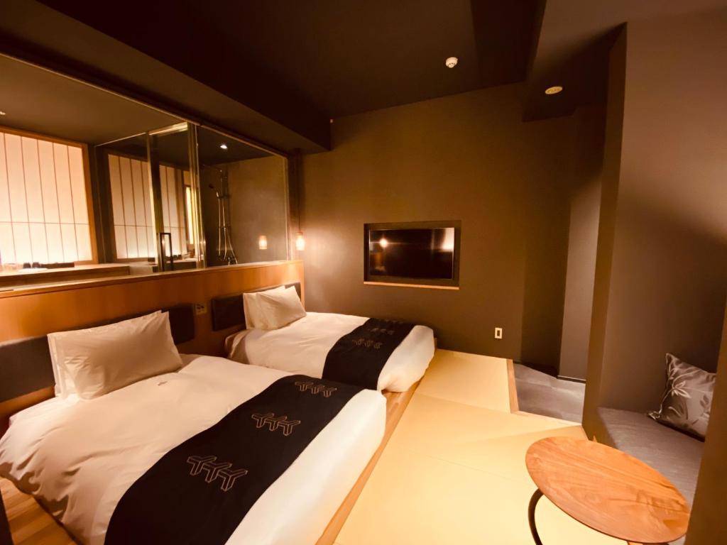 Postel nebo postele na pokoji v ubytování Hotel Zagakukan