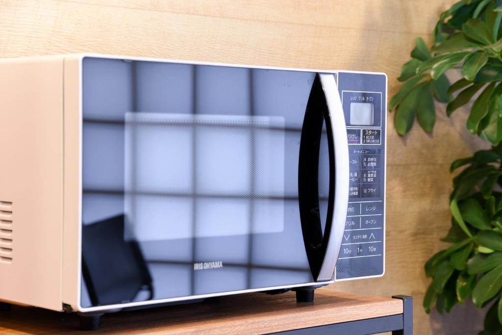 TV a/nebo společenská místnost v ubytování Otsuka Town Hotel
