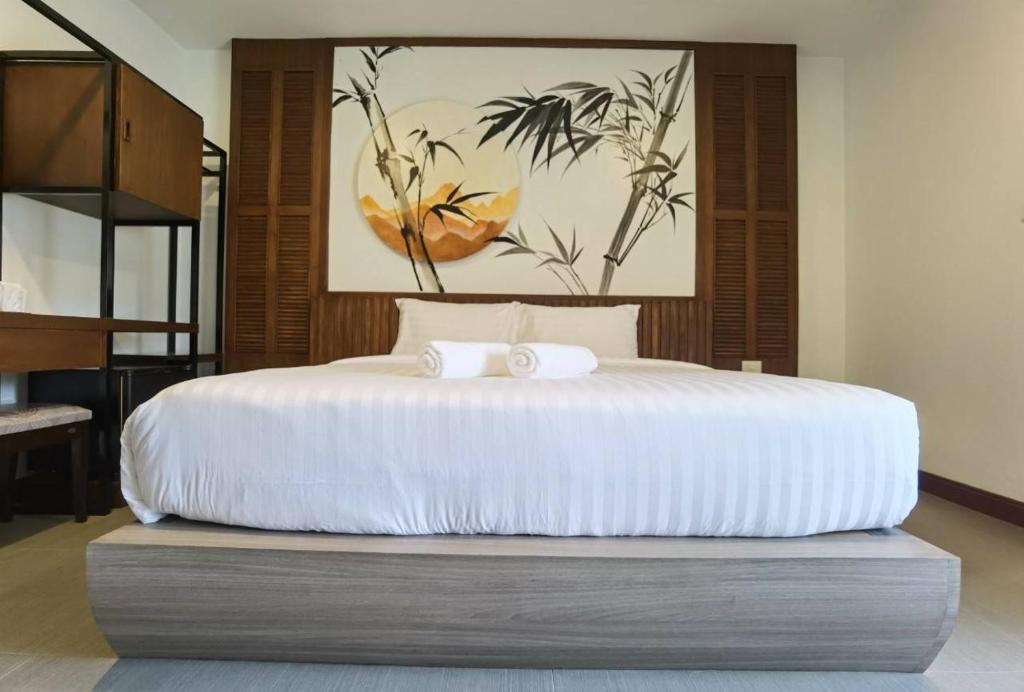 Postel nebo postele na pokoji v ubytování โรงแรมชลาลัย กระบี่ Chalalai Hotel Krabi