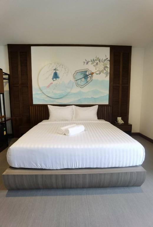 Postel nebo postele na pokoji v ubytování โรงแรมชลาลัย กระบี่ Chalalai Hotel Krabi