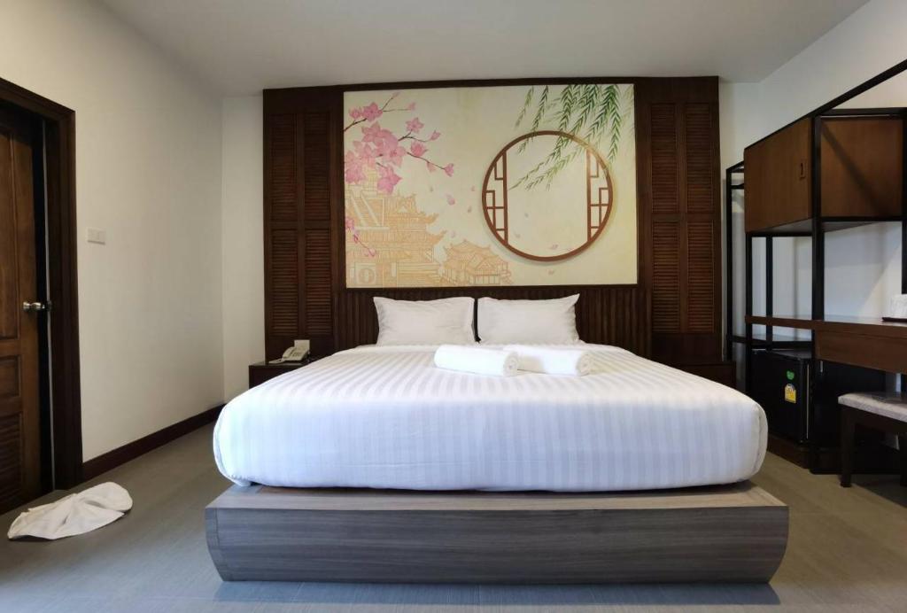 Postel nebo postele na pokoji v ubytování โรงแรมชลาลัย กระบี่ Chalalai Hotel Krabi