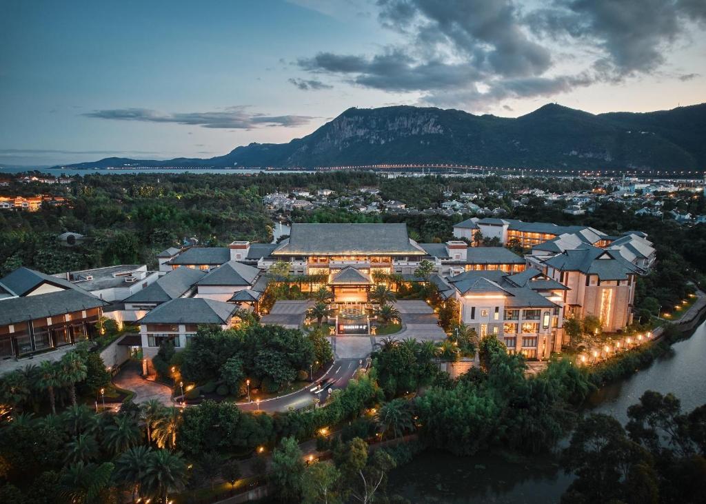 an aerial view of a resort with a mountain in the background at HUALUXE Hotels & Resorts Kunming, an IHG Hotel in Kunming