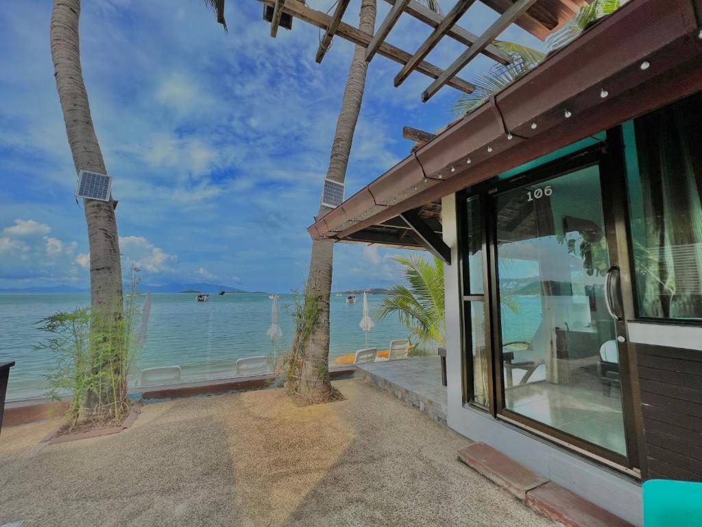a building with a view of the ocean at The Shore Samui in Bang Rak Beach
