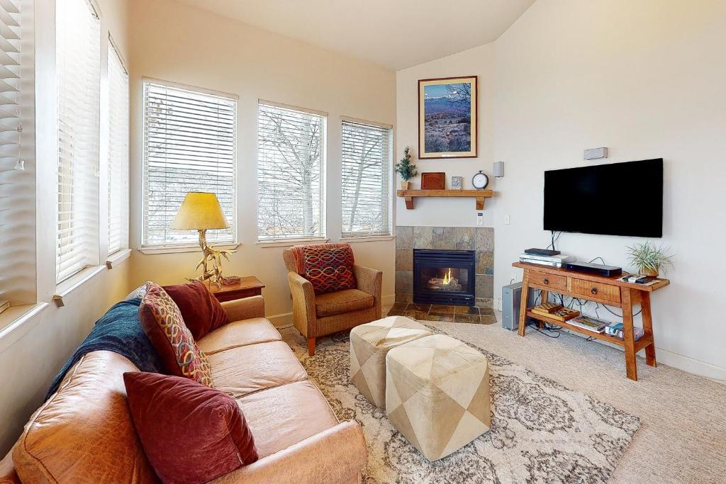 a living room with a couch and a television at The Restful Retreat in Park City