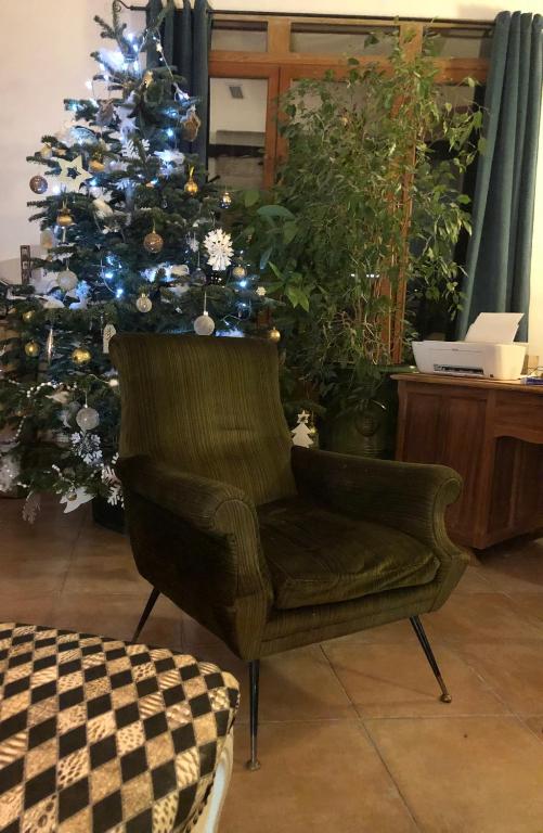 a chair in front of a christmas tree at Au bout du pré in Pézenas