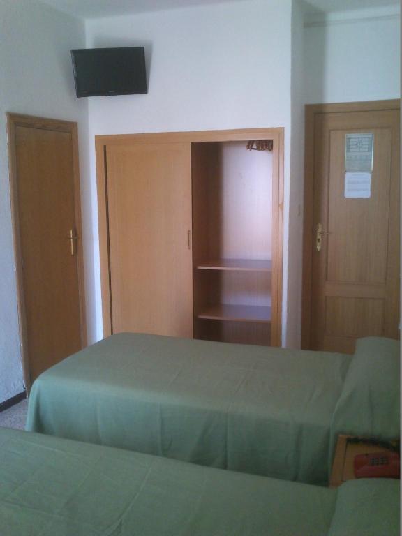 Postel nebo postele na pokoji v ubytování Hotel Bari