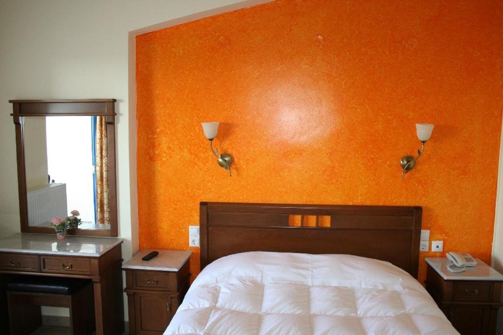 Postel nebo postele na pokoji v ubytování Agnadi Hotel