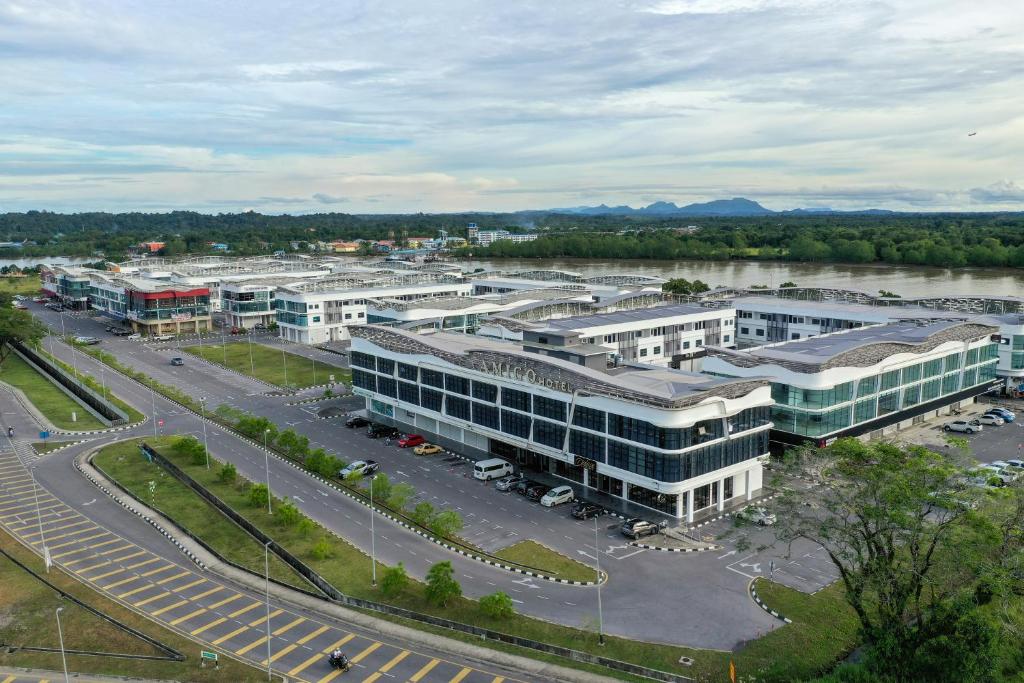 an aerial view of a large building with a parking lot at Amigo Hotel Bintulu in Bintulu