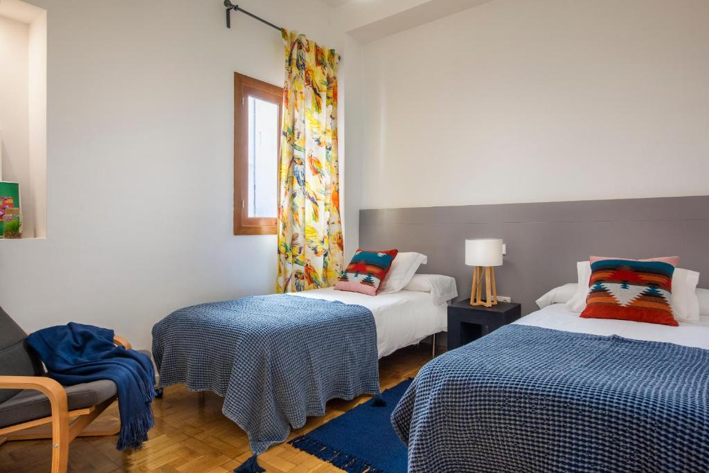 A bed or beds in a room at Genteel Home Cabildo