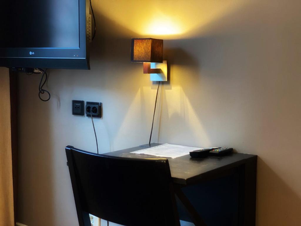 TV a/nebo společenská místnost v ubytování Hotel Villan