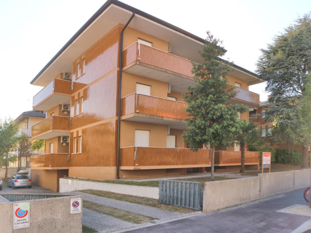 a building with balconies on the side of it at Carinzia in Lignano Sabbiadoro