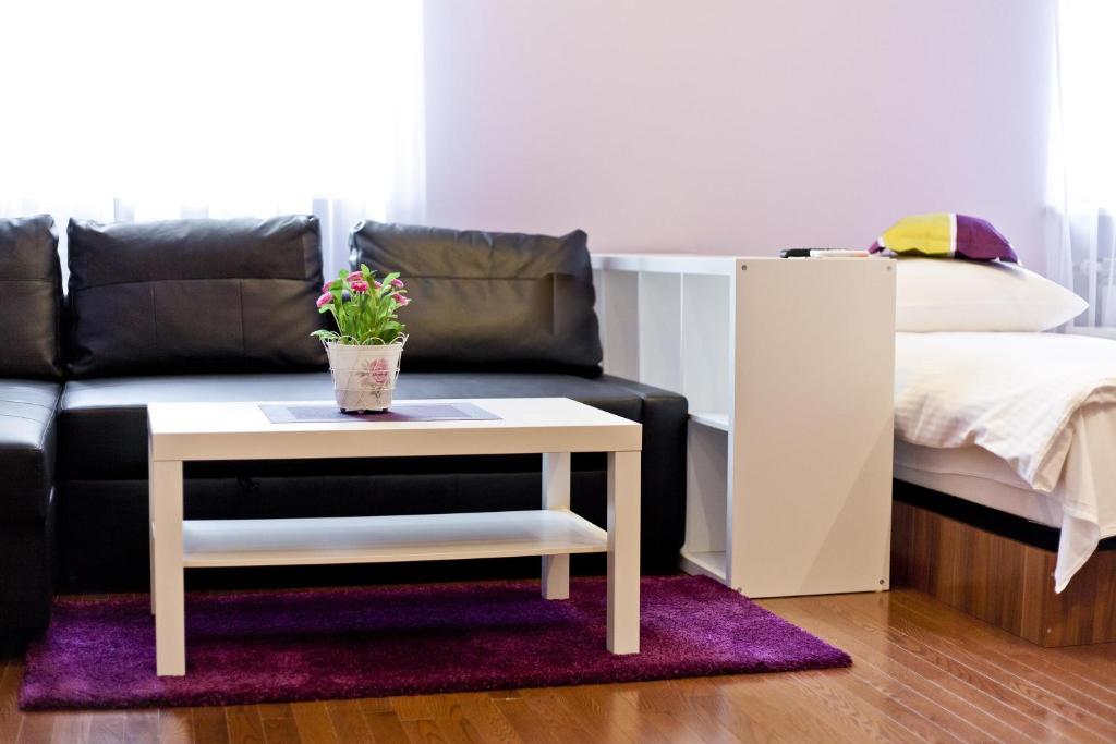 Postel nebo postele na pokoji v ubytování Apartamenty Przemyśl