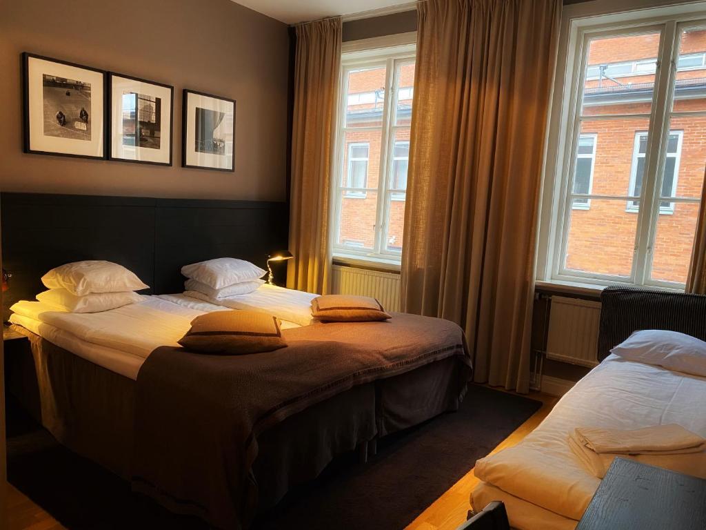 Postel nebo postele na pokoji v ubytování Hotel Villan