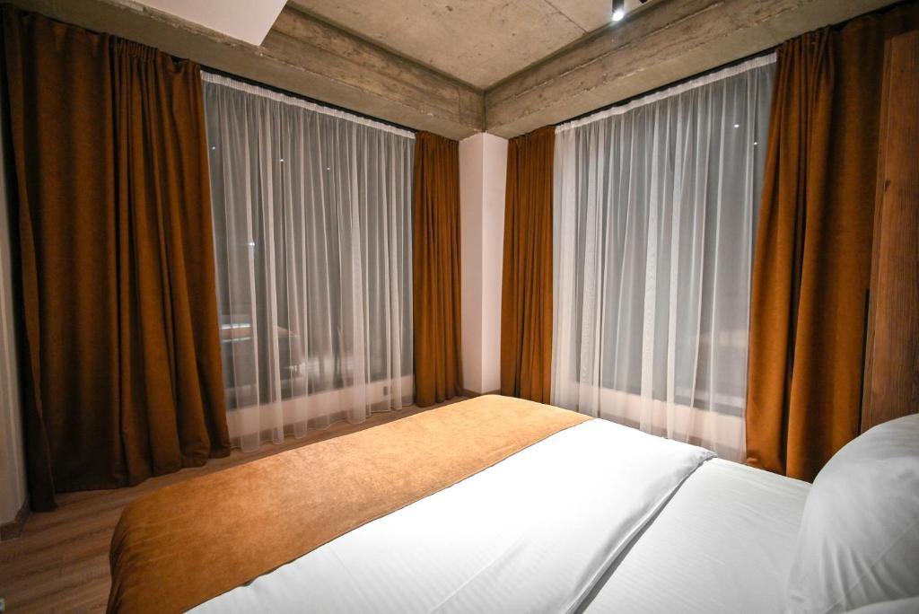 Postel nebo postele na pokoji v ubytování Rooms Apart-Hotel by RED