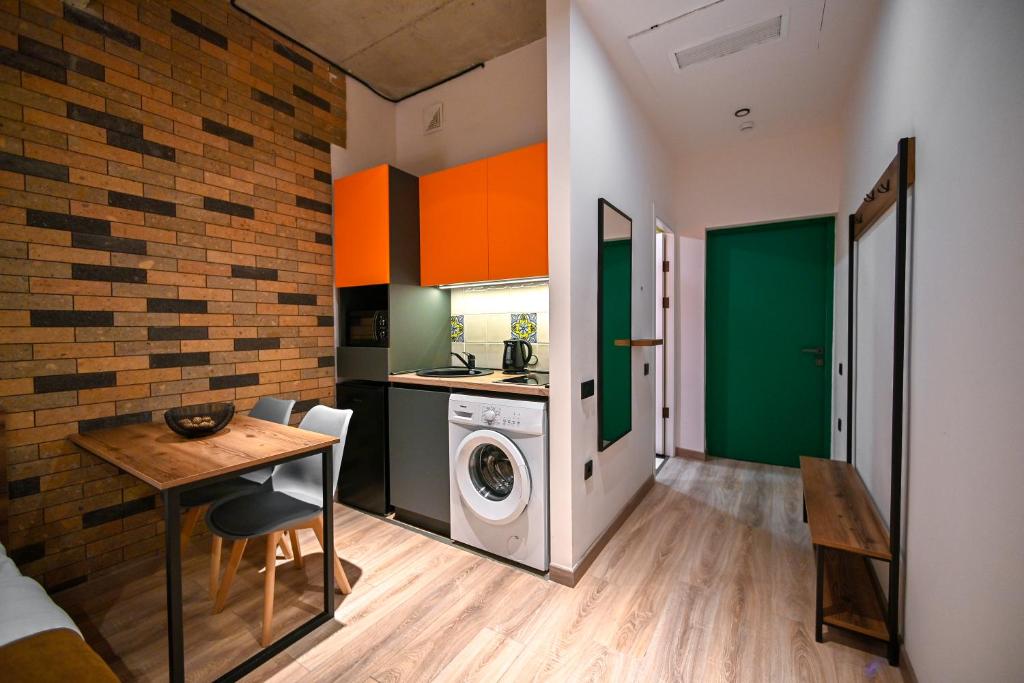 Kuchyň nebo kuchyňský kout v ubytování Rooms Apart-Hotel by RED