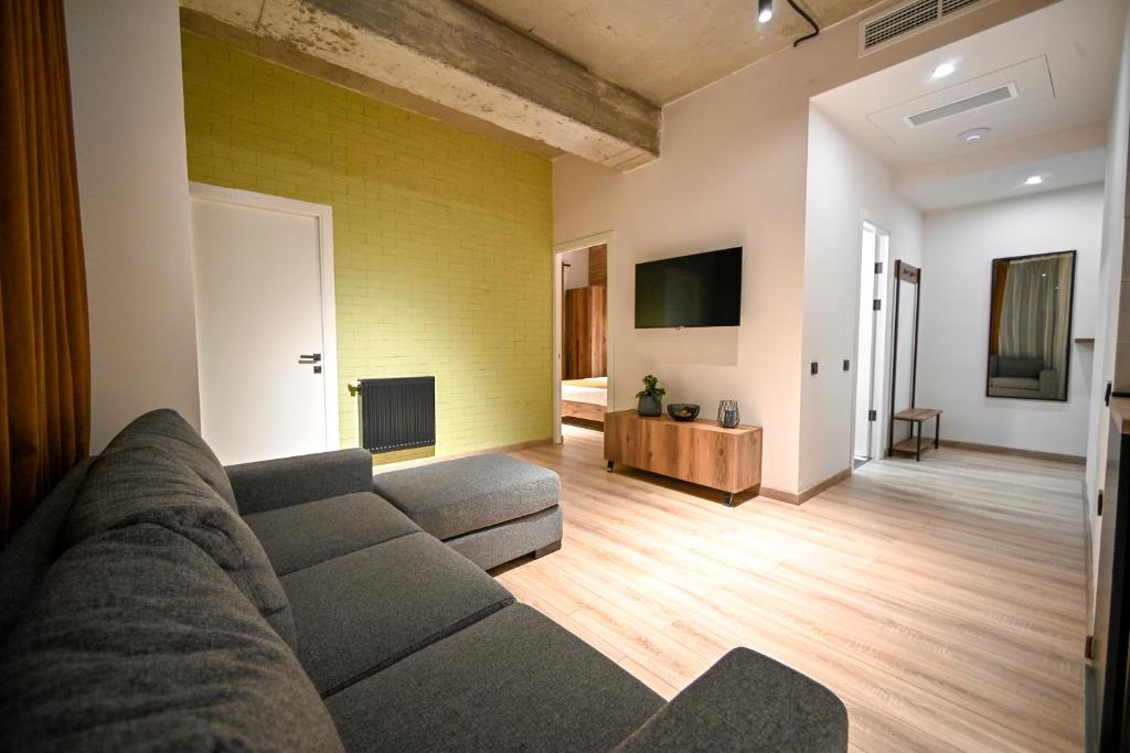 TV a/nebo společenská místnost v ubytování Rooms Apart-Hotel by RED