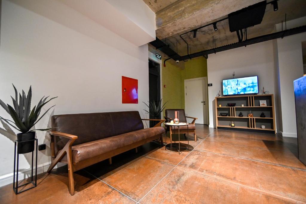 TV a/nebo společenská místnost v ubytování Rooms Apart-Hotel by RED