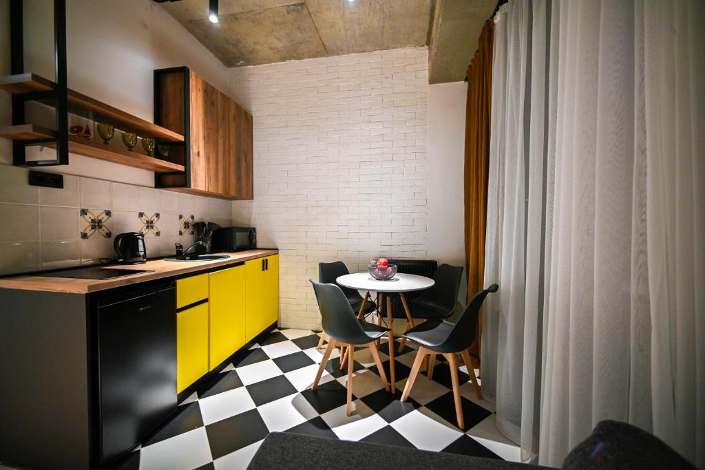 Kuchyň nebo kuchyňský kout v ubytování Rooms Apart-Hotel by RED