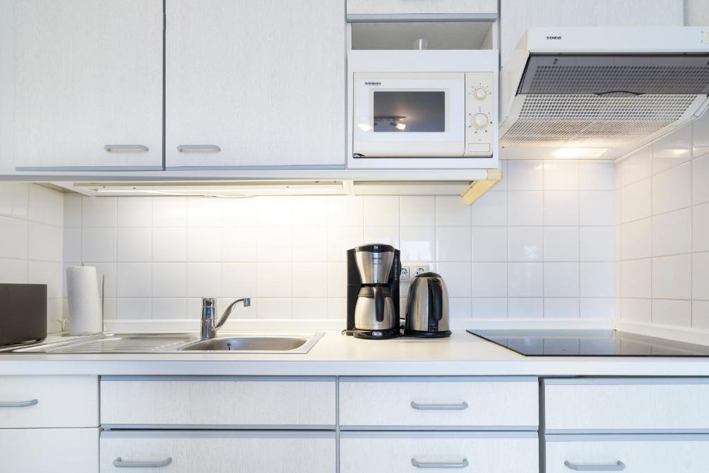 Kuchyň nebo kuchyňský kout v ubytování Wohnpark am Mühlenteich - Appartement 24