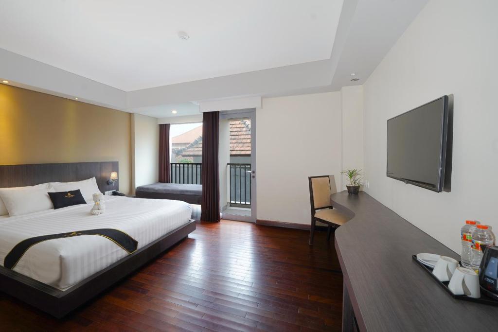Postel nebo postele na pokoji v ubytování Brits Hotel Legian