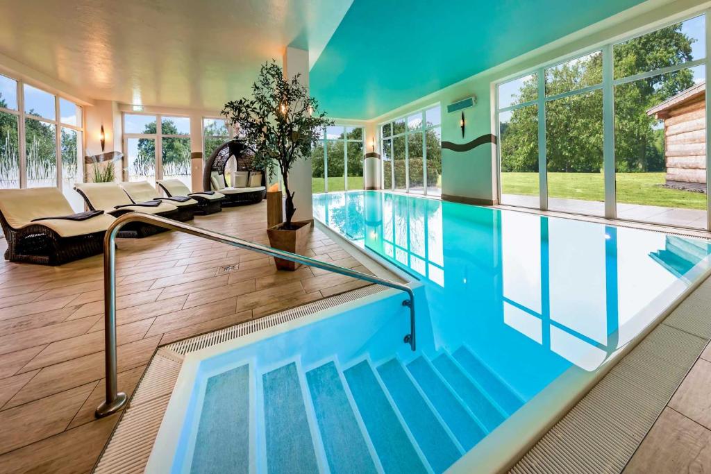 a swimming pool in a house at Land gut Hotel Hermann in Bentwisch