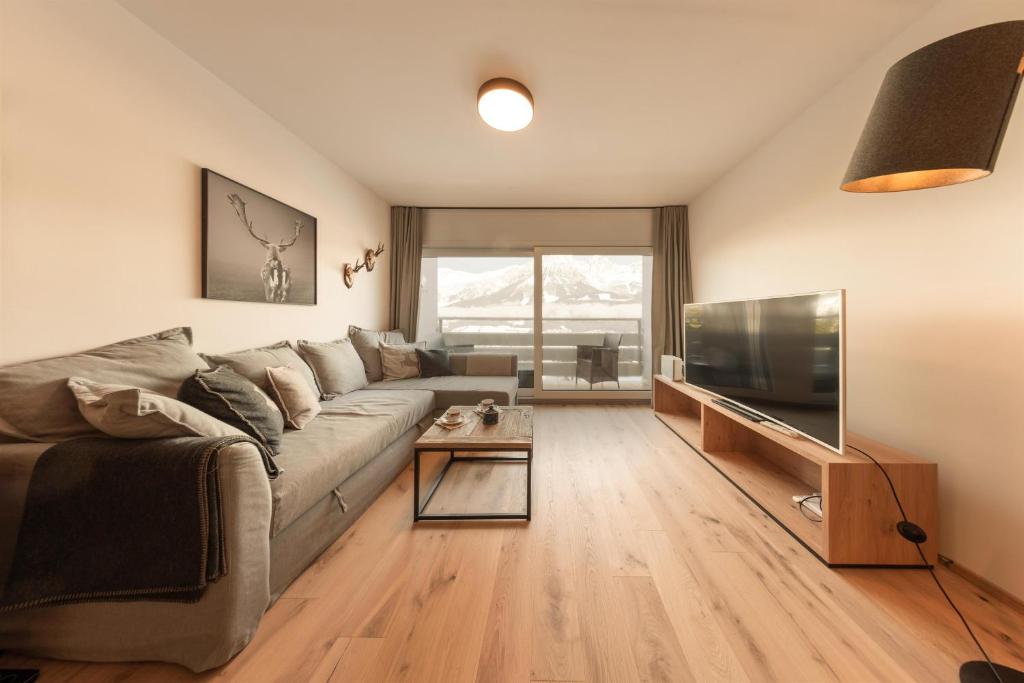 Televízia a/alebo spoločenská miestnosť v ubytovaní Apartment Alpenblick