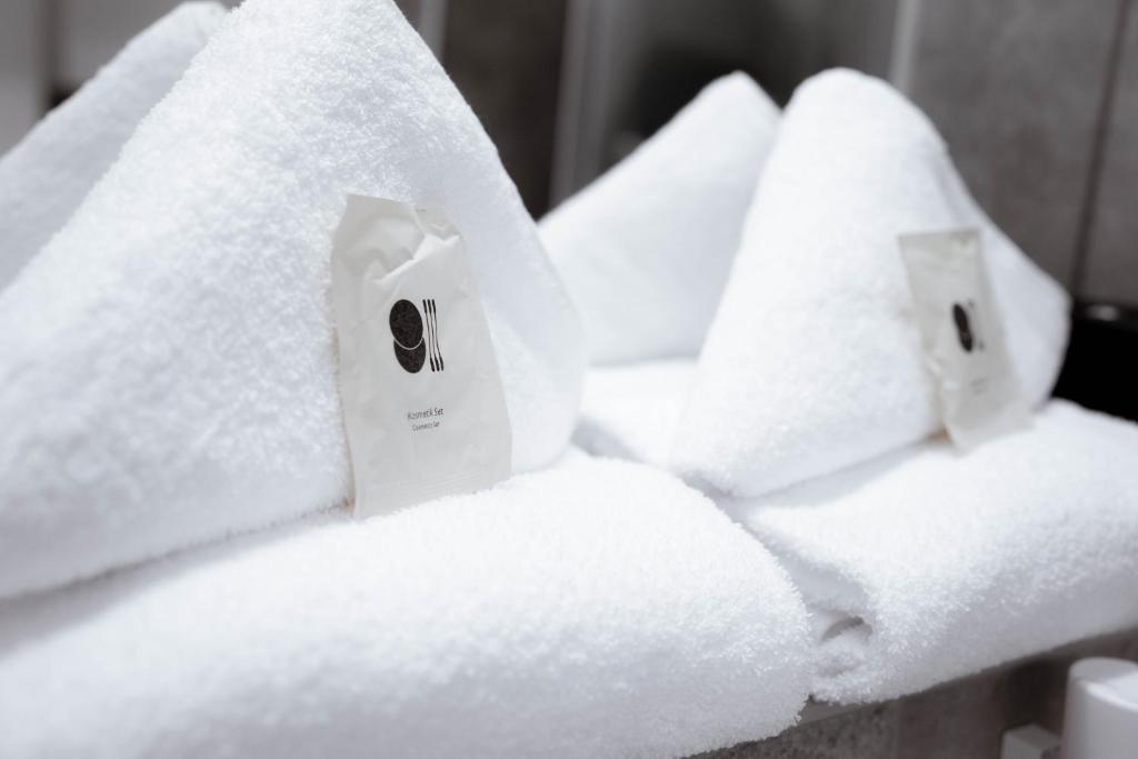 Postel nebo postele na pokoji v ubytování Reos Hotel Wangen