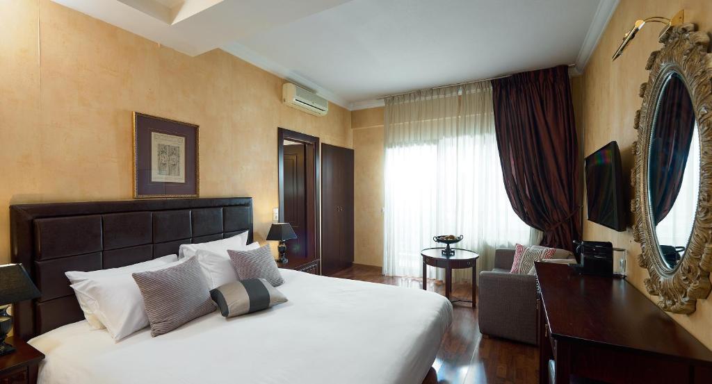 Postel nebo postele na pokoji v ubytování Olympus Mediterranean Boutique Hotel