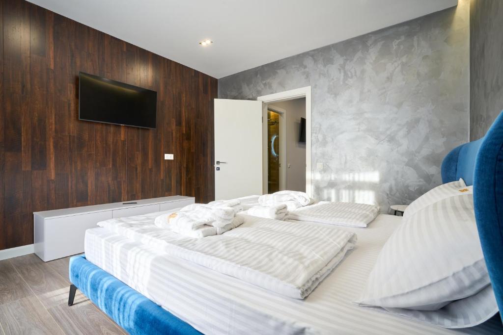 Postel nebo postele na pokoji v ubytování Olimp Hotel