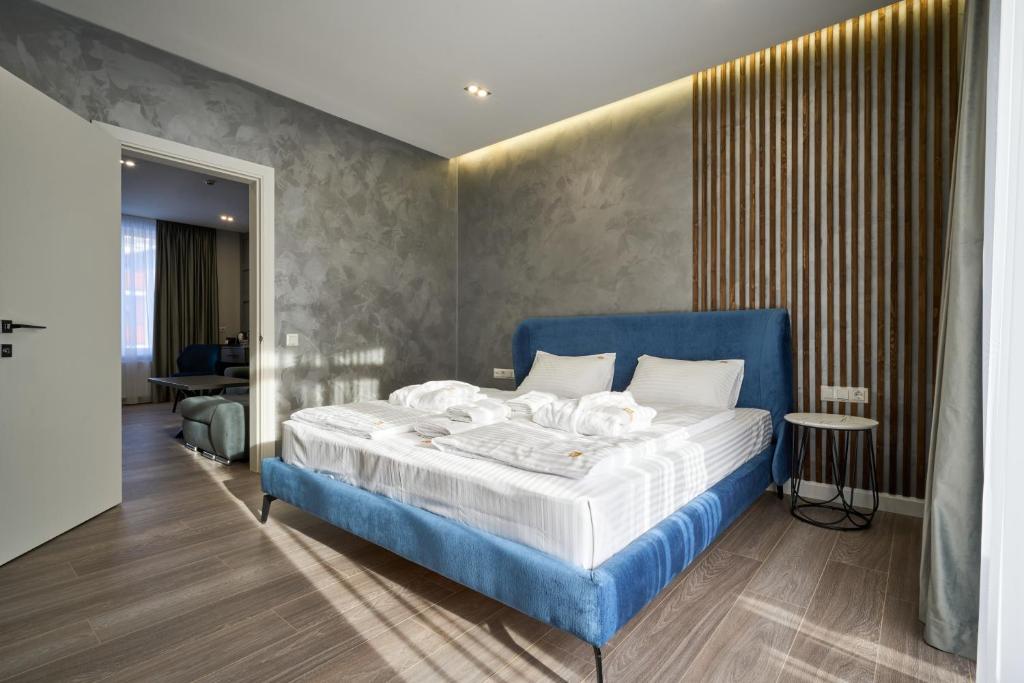 Postel nebo postele na pokoji v ubytování Olimp Hotel