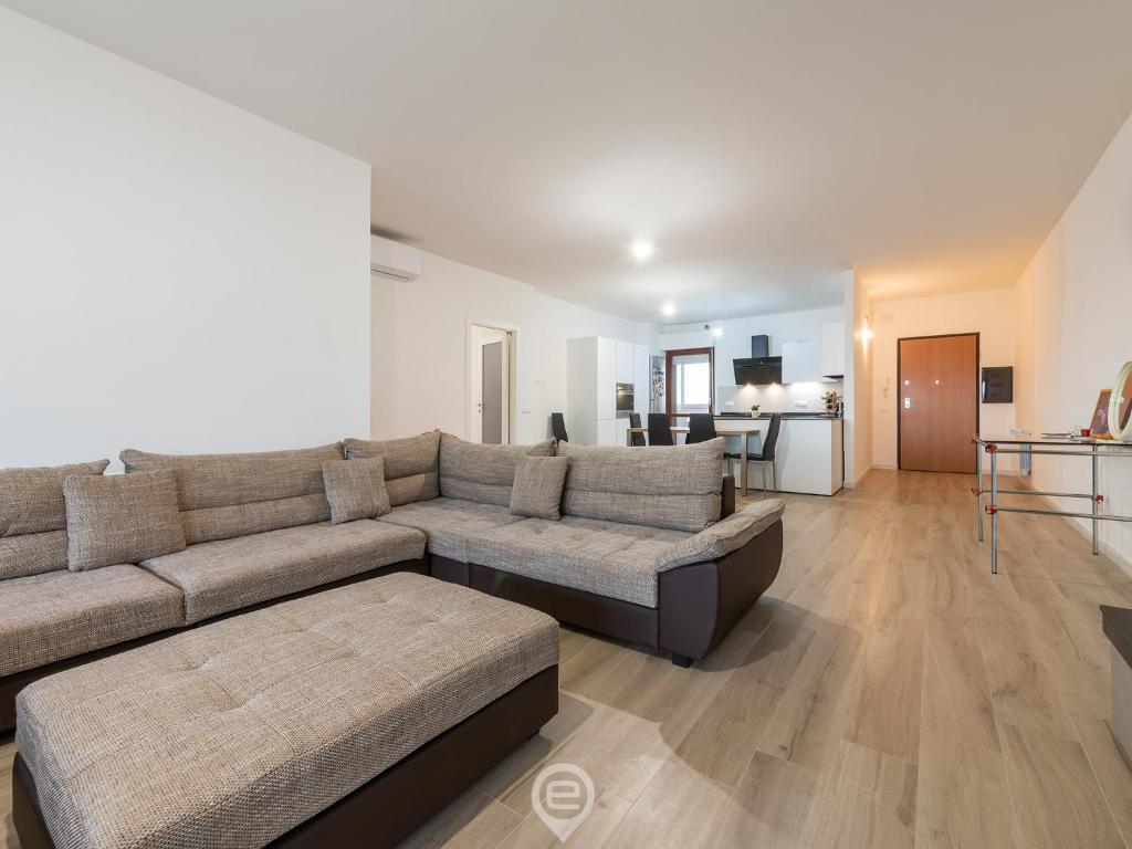 a living room with a couch and a table at Giulia's House in Oristano